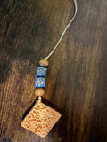 Square flower pendant with blue beads