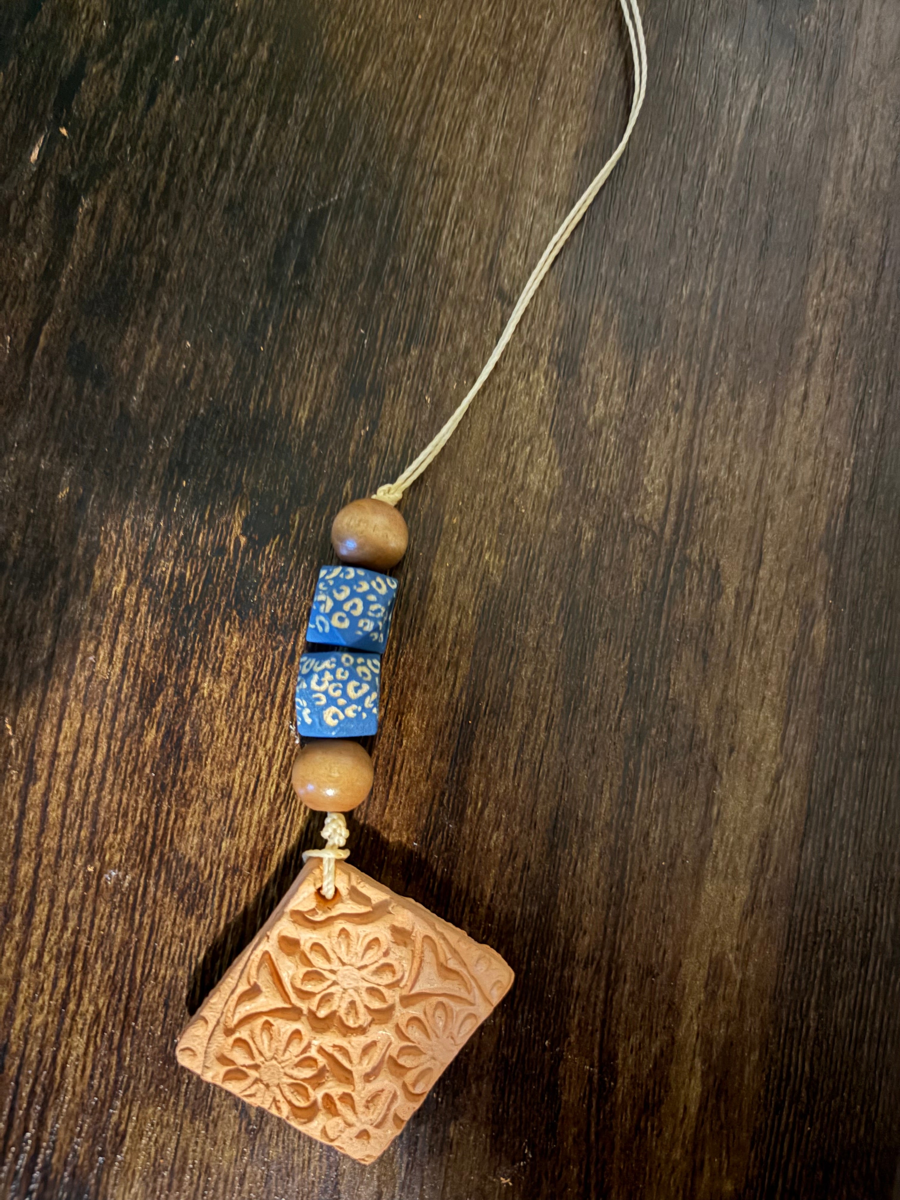Square flower pendant with blue beads